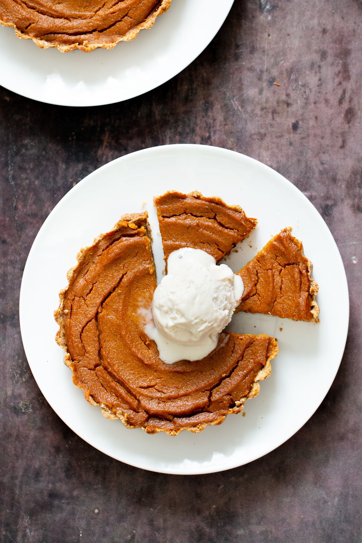 gluten free vegan pumpkin pie individual gluten free vegan pumpkin pie on a plate with two mini slices cut