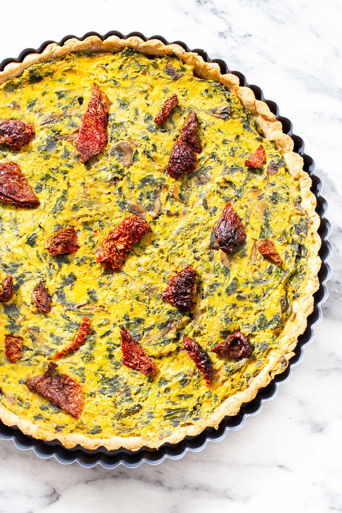vegan quiche recipe freshly baked vegan quiche with mushroom, spinach and leeks