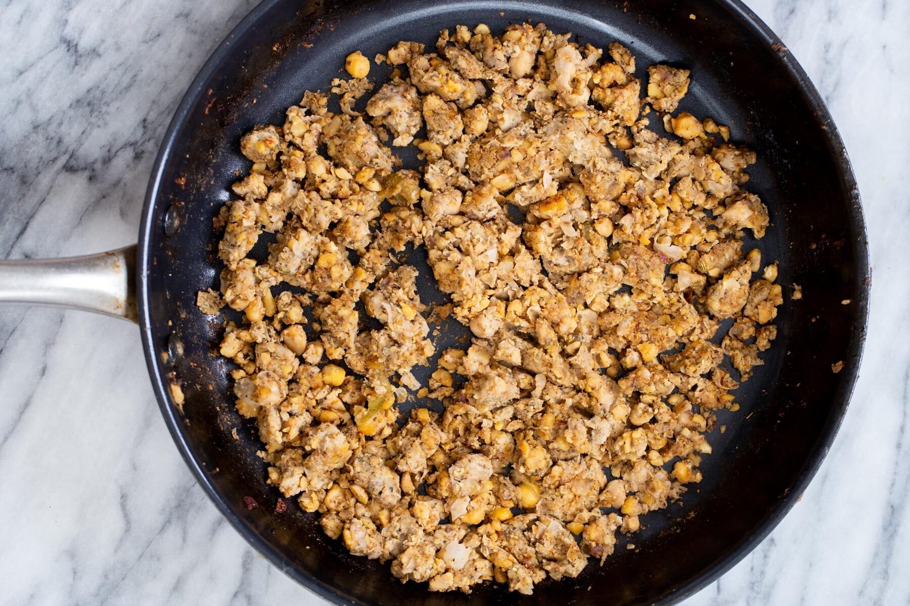 vegan stuffing vegan chickpea stuffing in a sauteeing pan