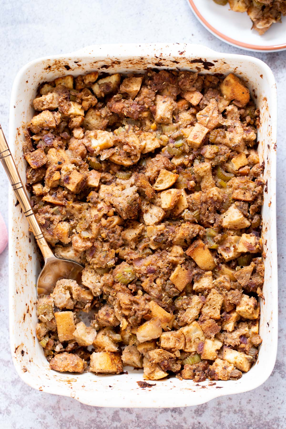 vegan stuffing Vegan Stuffing with chickpea sausage in a white casserole dish