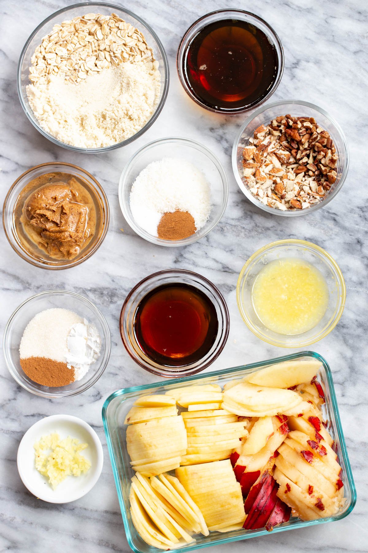apple pear crisp ingredients needed for making apple pear crisp on a marble counter