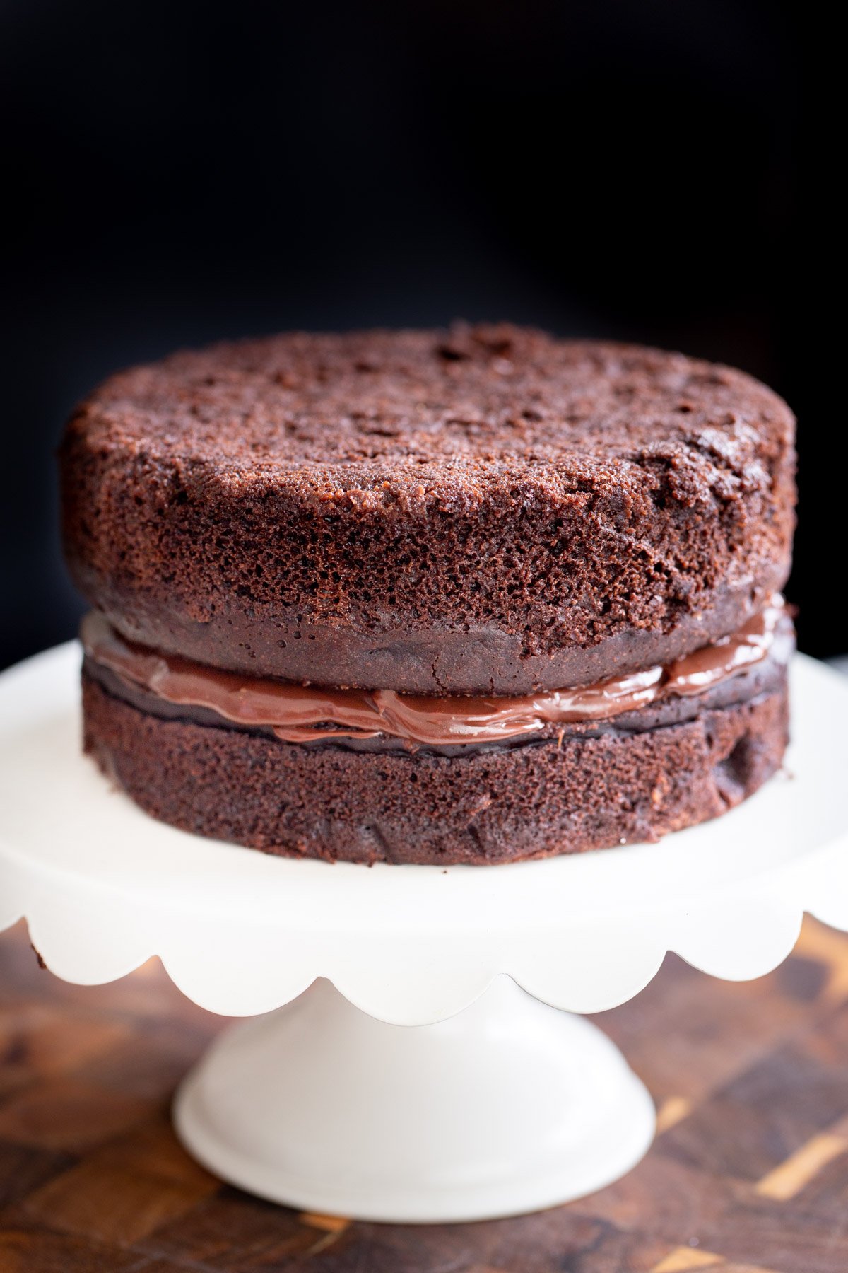 vegan chocolate layer cake filled with vegan coconut milk ganache