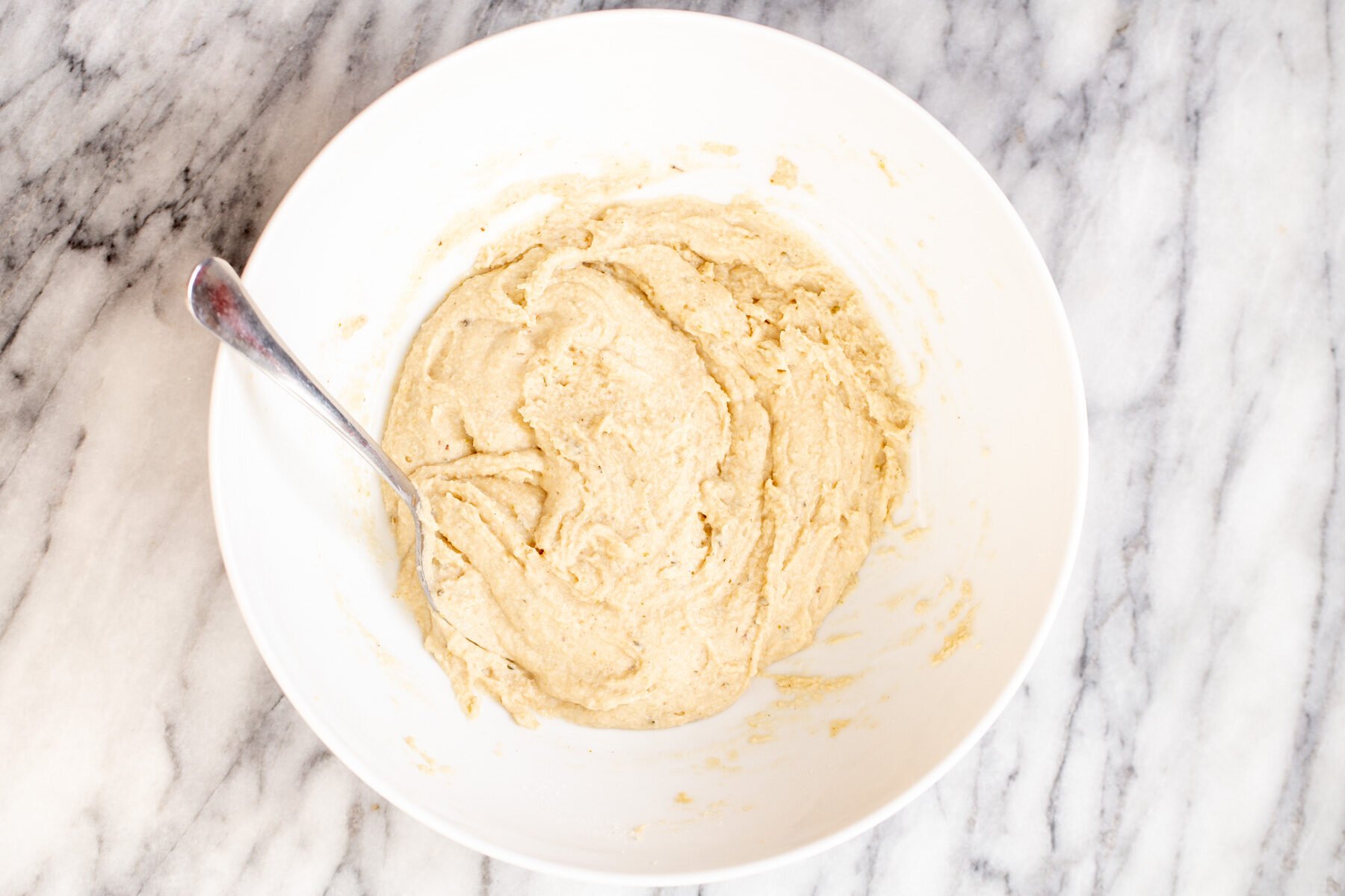 glutenfree focaccia bread dough in a white bowl
