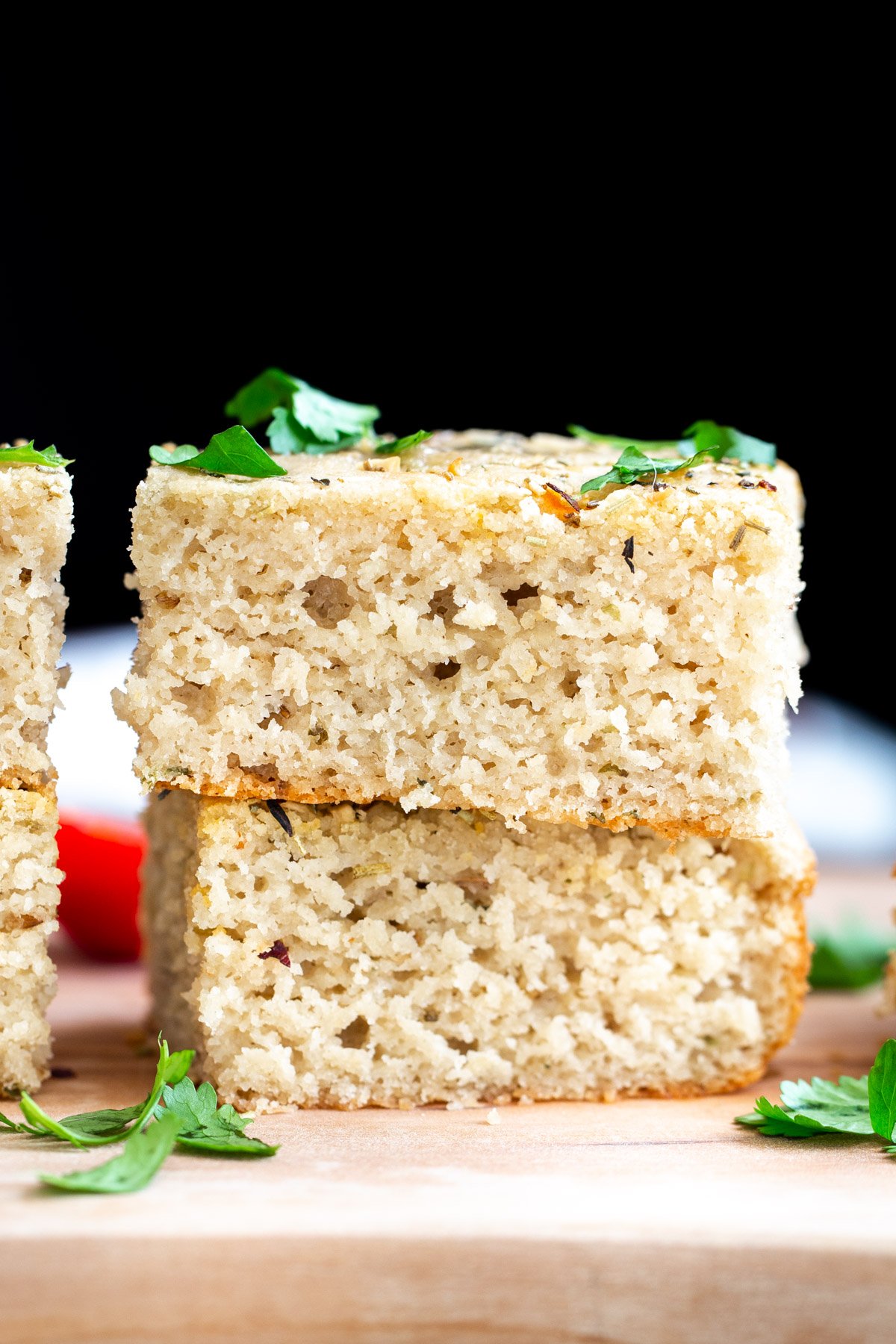 glutenfree focaccia  stacked slices of vegan glutenfree focaccia bread on a wooden board