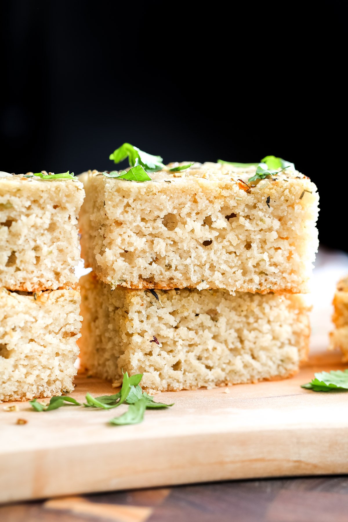 glutenfree focaccia stacked sliced of focaccia on a wooden board