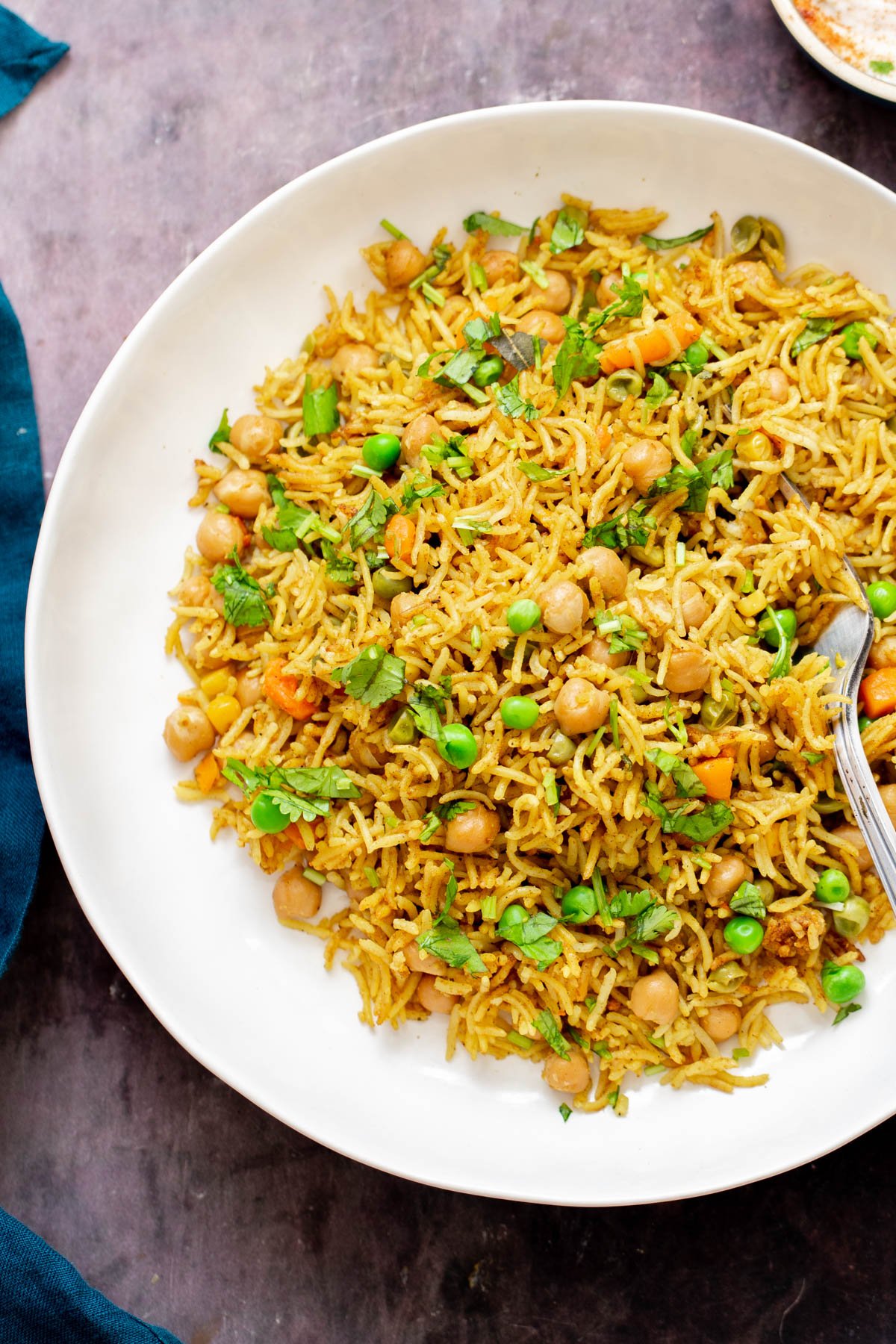 chickpea fried rice chickpea fried rice on a white plate with a fork