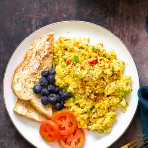 vegan tofu scramble served with a side of toast and vegetables