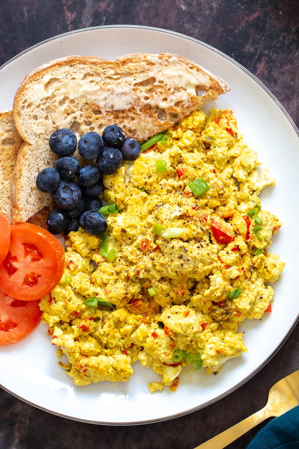 tofu scramble seasoning vegan tofu scramble served with blueberries and buttered toast