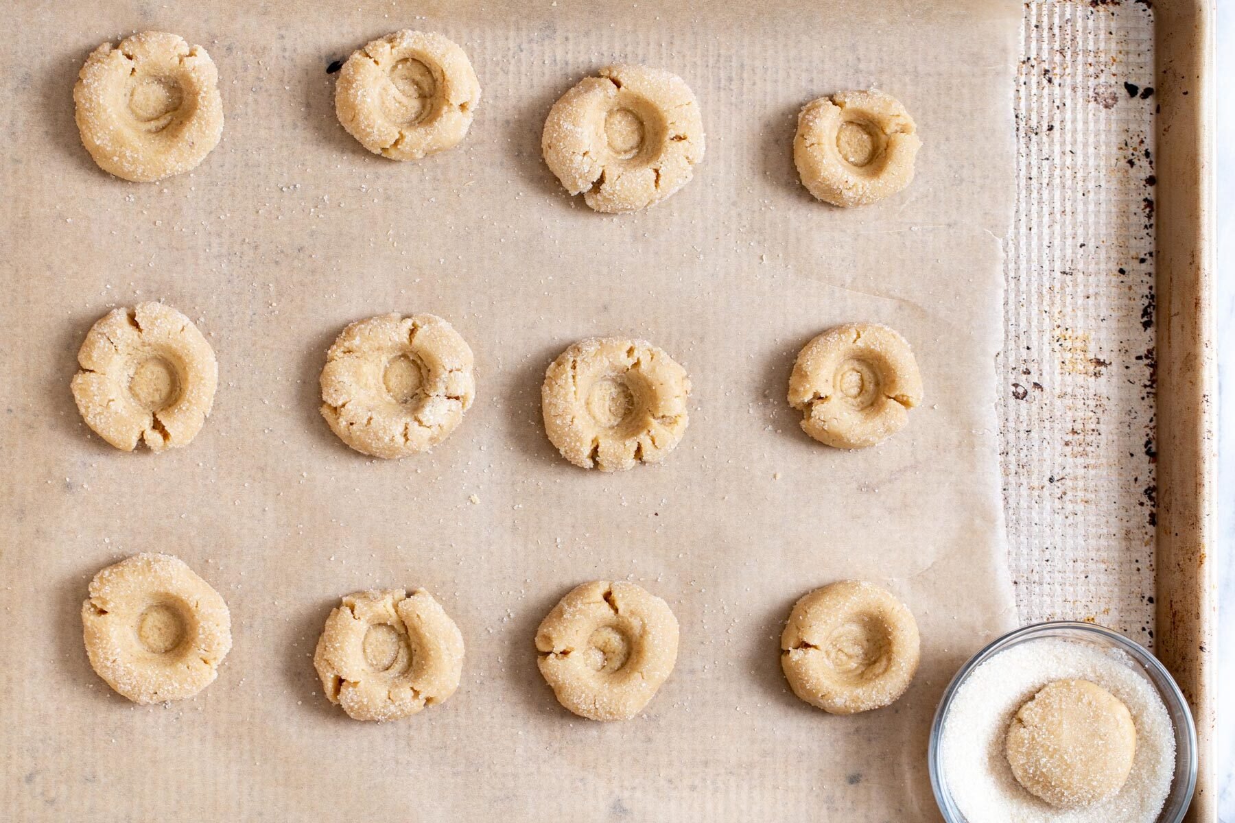 glutenfree thumbprint cookies on a baking sheet
