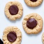 vegan glutenfree chocolate thumbprint cookies on a white plate