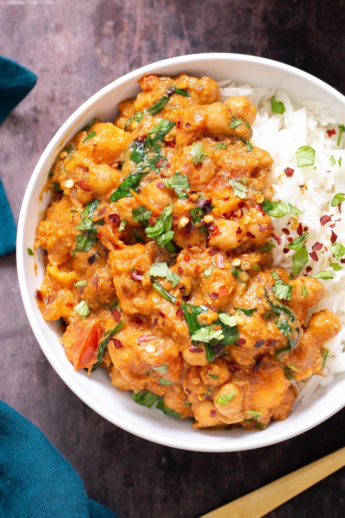 overhead shot of a bowl of chickpea sweet potato curry served over rice