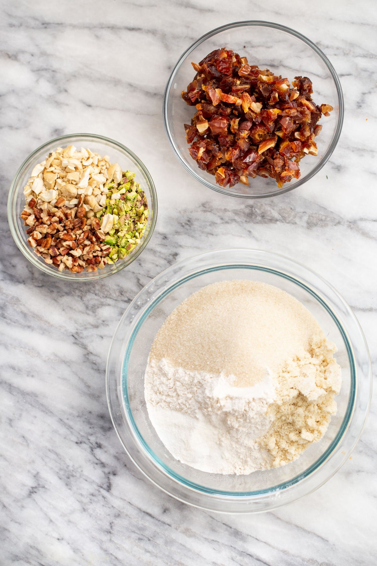 cookie mix in a jar ingredients needed for making cookie mix in a jar on a marble countertop