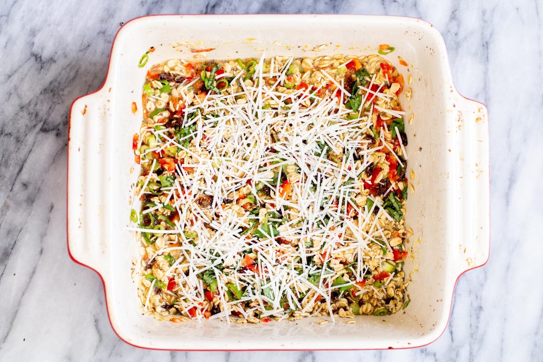 savory oatmeal bake  pizza baked oatmeal topped with shredded vegan mozarella