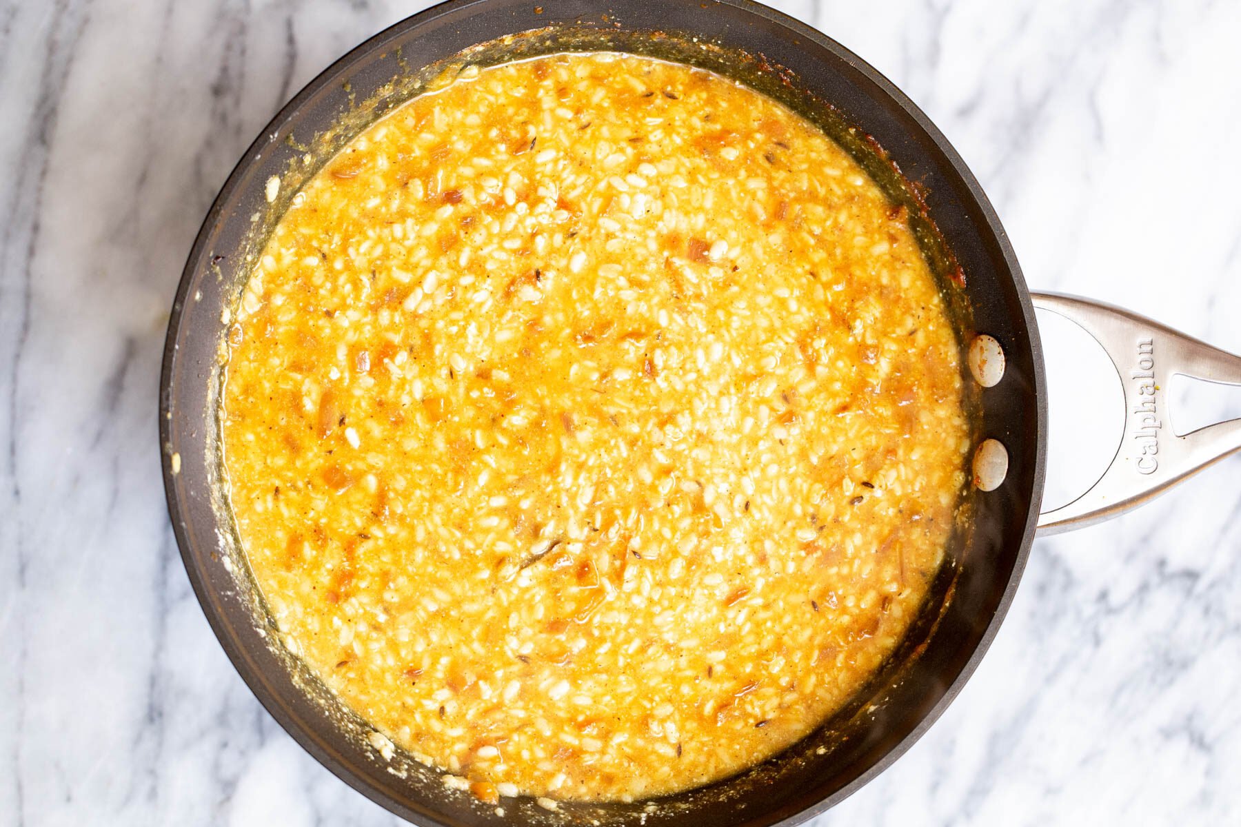 urad dal in a black skillet
