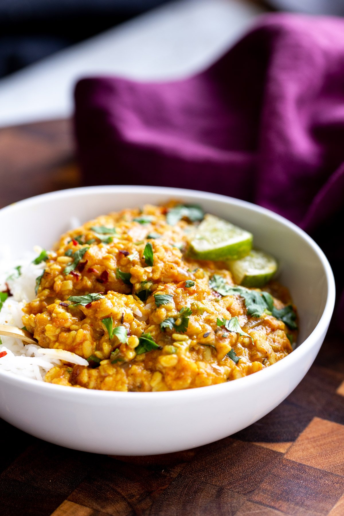 spicy urad dal spicy urad dal served in a white bowl