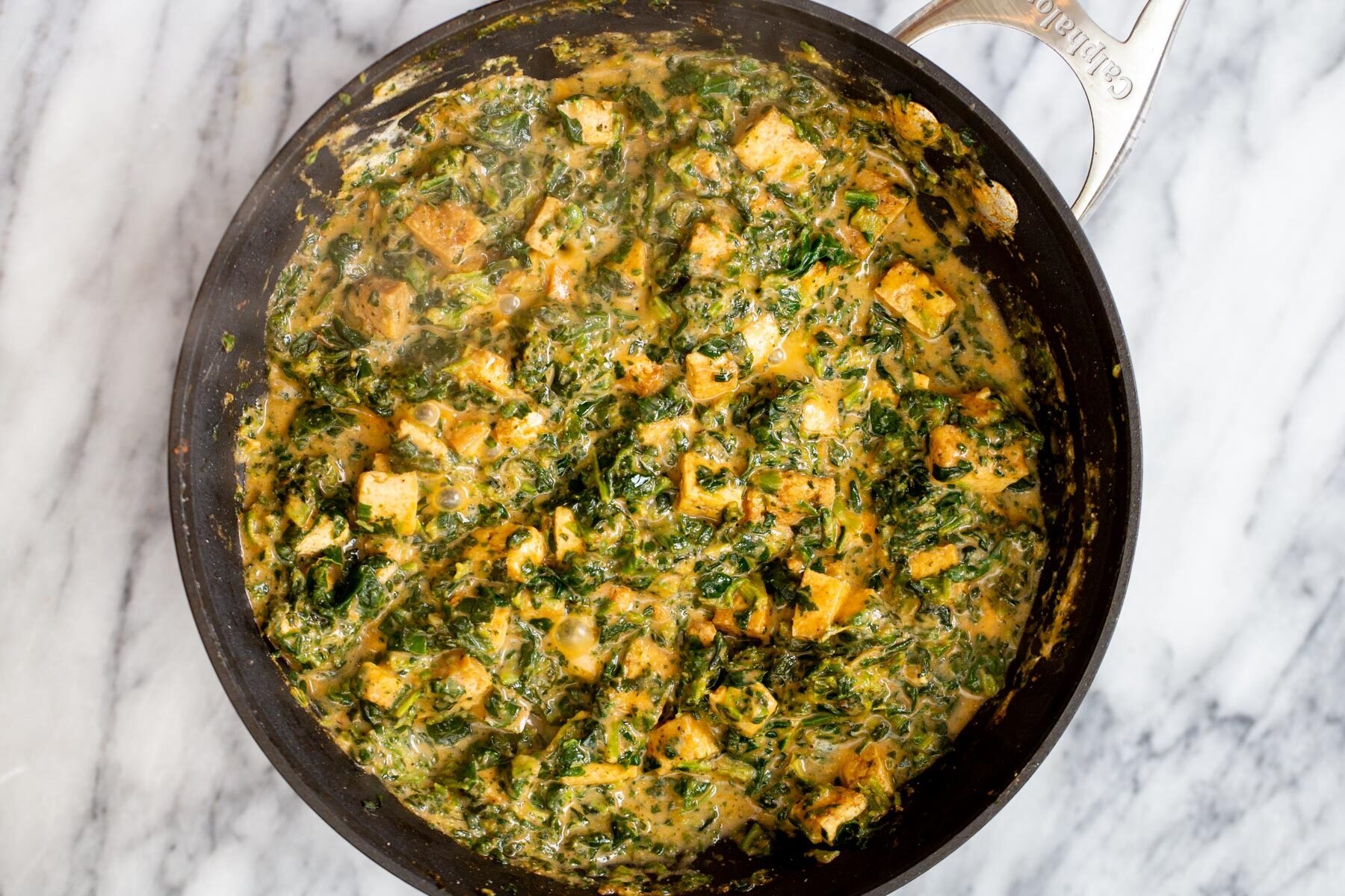 spinach tofu gravy tofu in a skillet in creamy spinach gravy