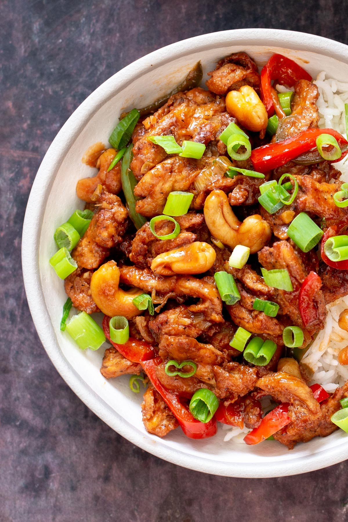 vegan soycurls with bell peppers and cashew nuts served over rice