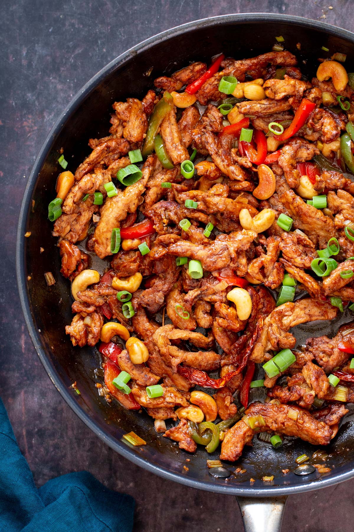 vegan soycurls tossed with sweet and spicy gravy, cashew nuts and bell peppers