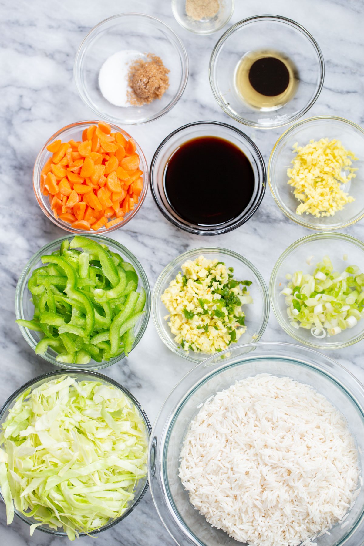 Indo Chinese Fried Rice ingredients needed for making fried rice on a marble countertop