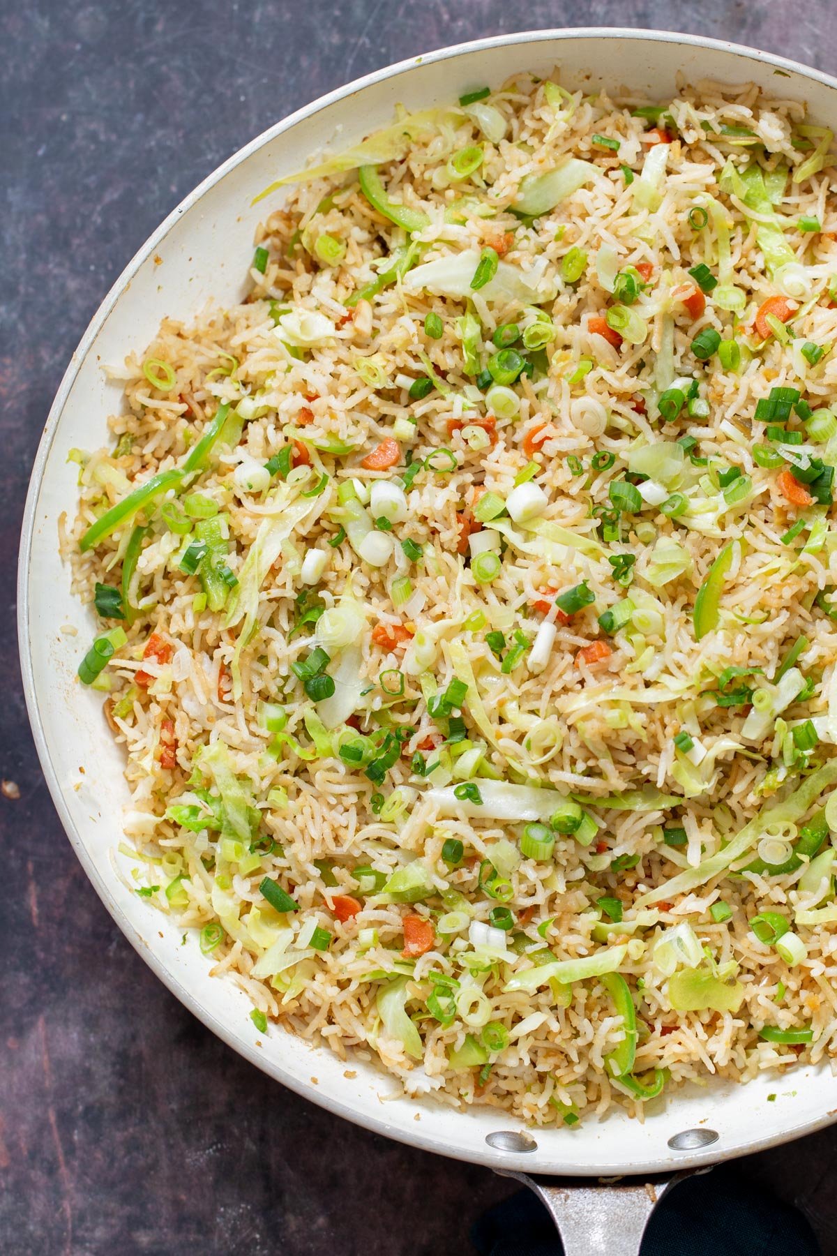 Indo Chinese fried rice a bowl of Indo Chinese Fried rice sprinkled with chopped scallions