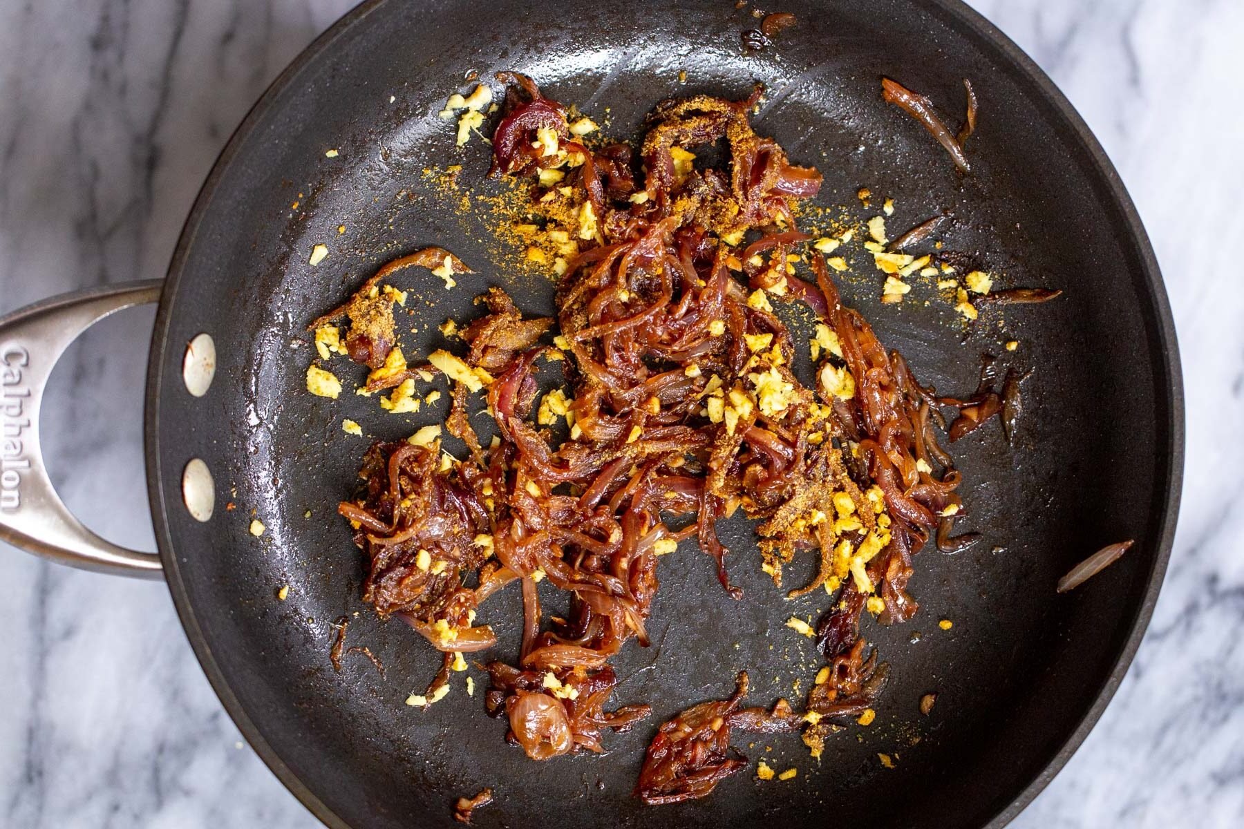 masoor dal tadka sauteed tempered onions and ginger in sauteeing pan