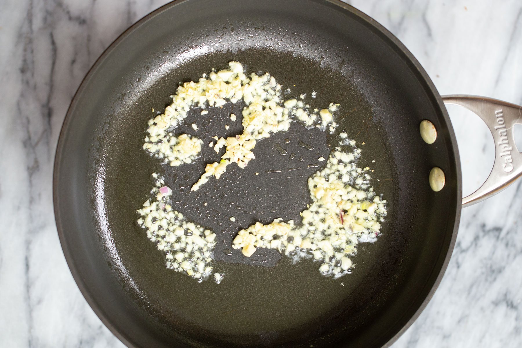 minced garlic in a frying pan