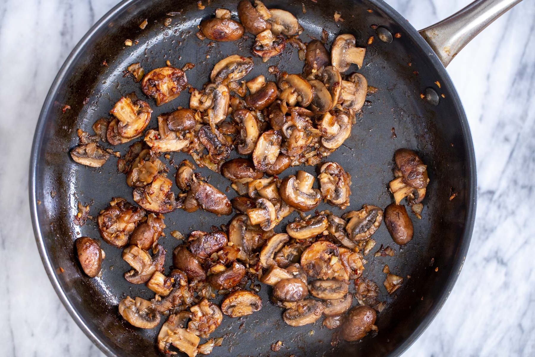 sauteed balsamic mushrooms in a black skillet