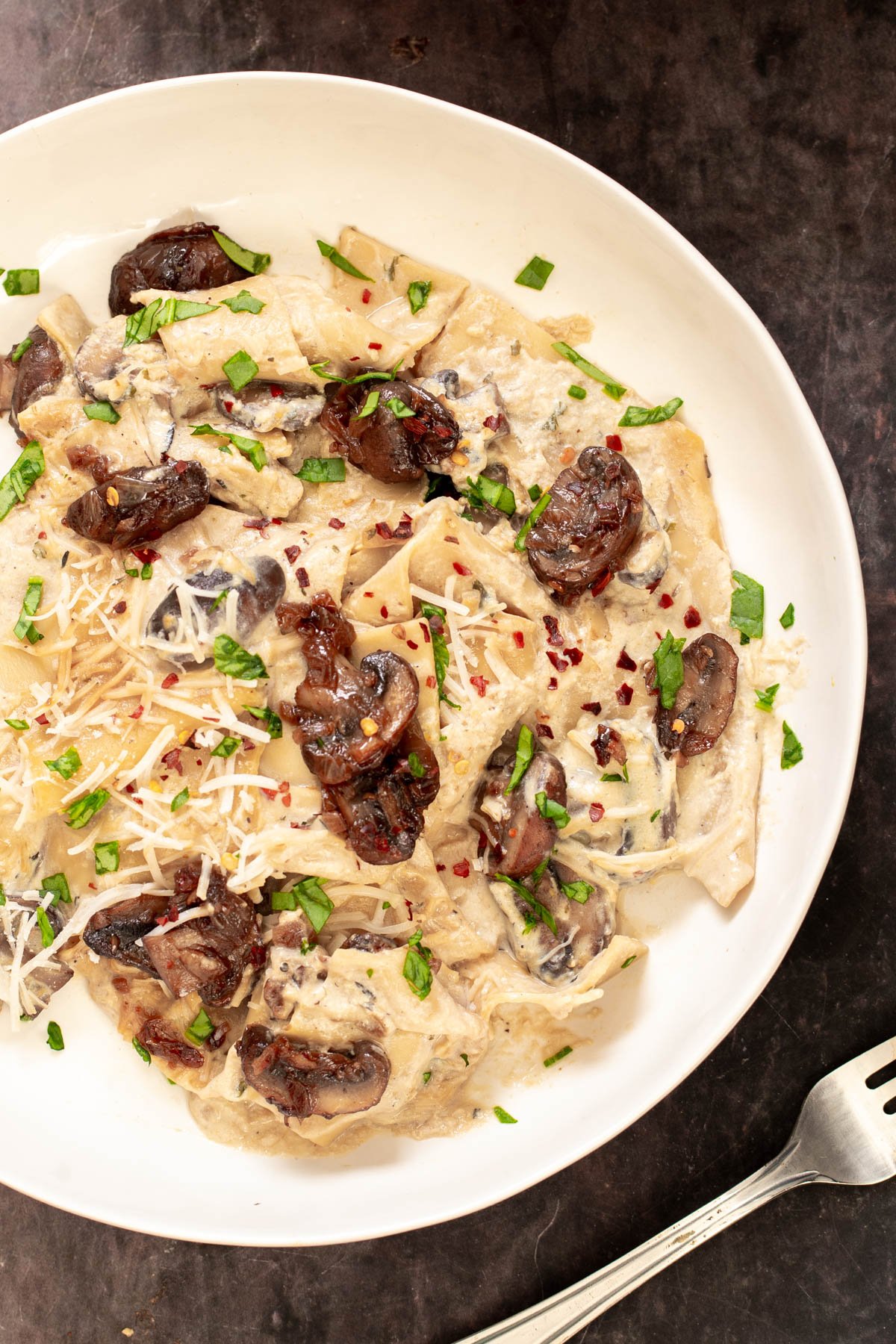 a serving of vegan white one pan lasagna with vegan bechamel and balsamic mushrooms