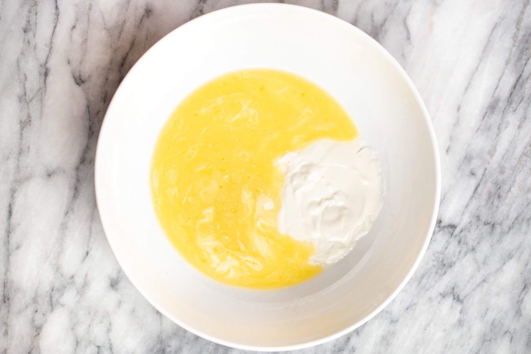melted butter and dairyfree yogurt in a bowl