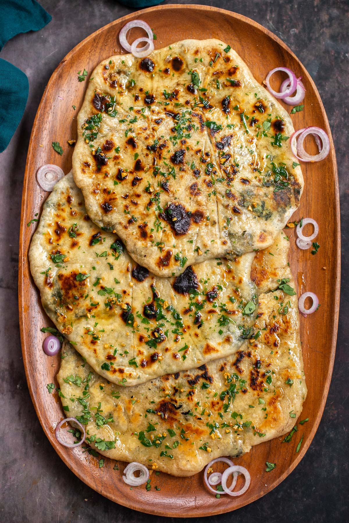 a platted with vegan stuffed naan bread with spinach potatoes and cheese