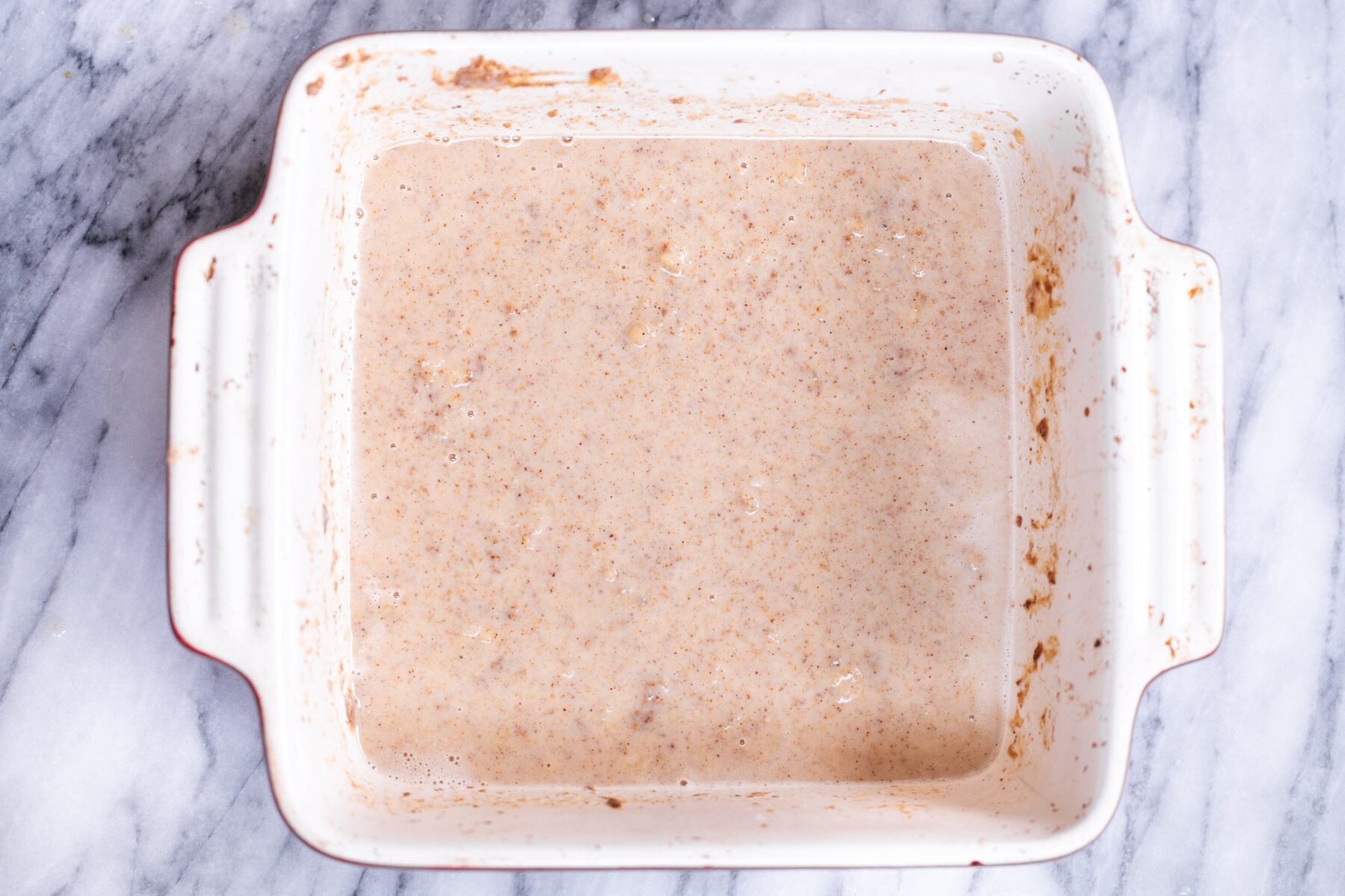 batter for banana oatmeal bars in a casserole dish