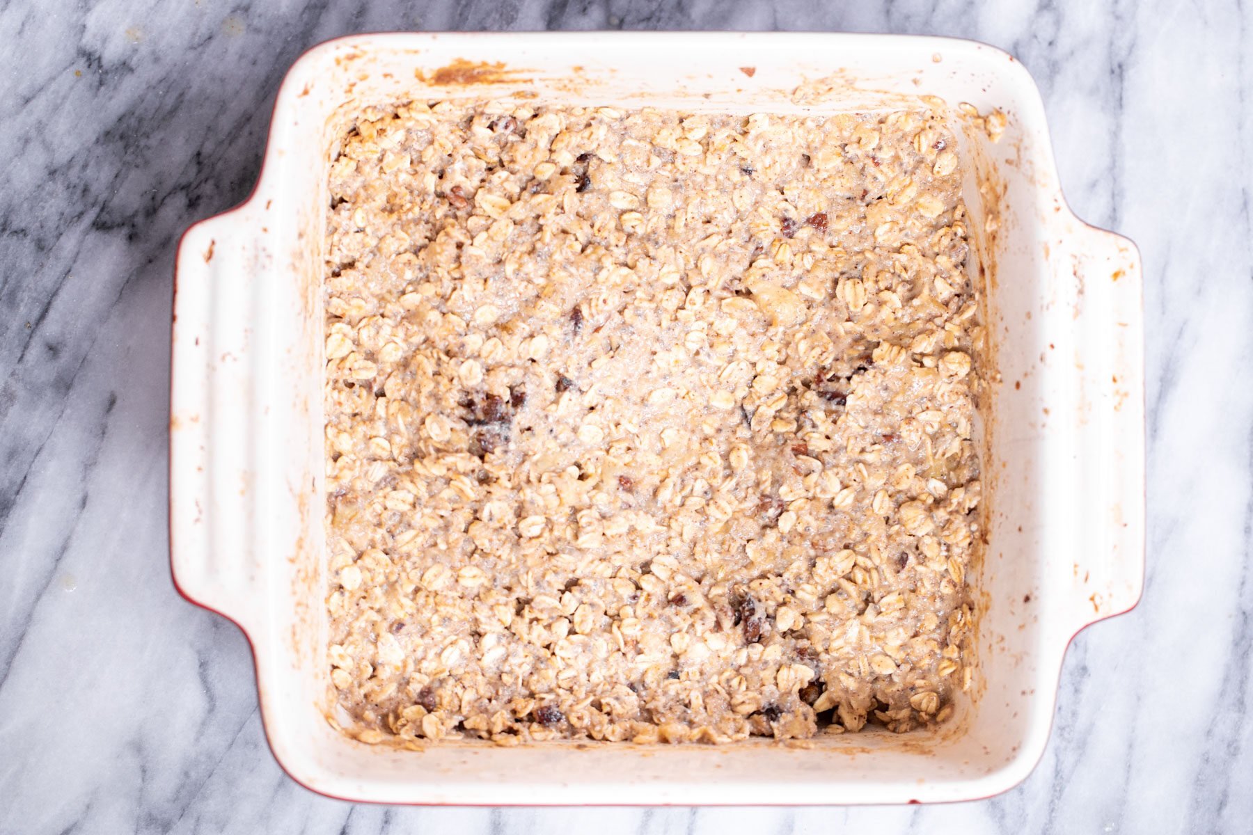 batter for banana oatmeal bars in a casserole dish