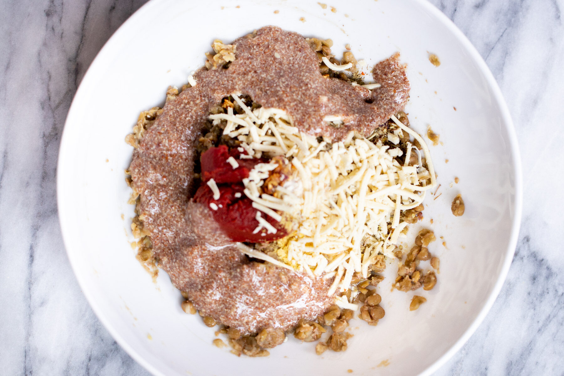 vegan lentil meatballs mix in a white bowl