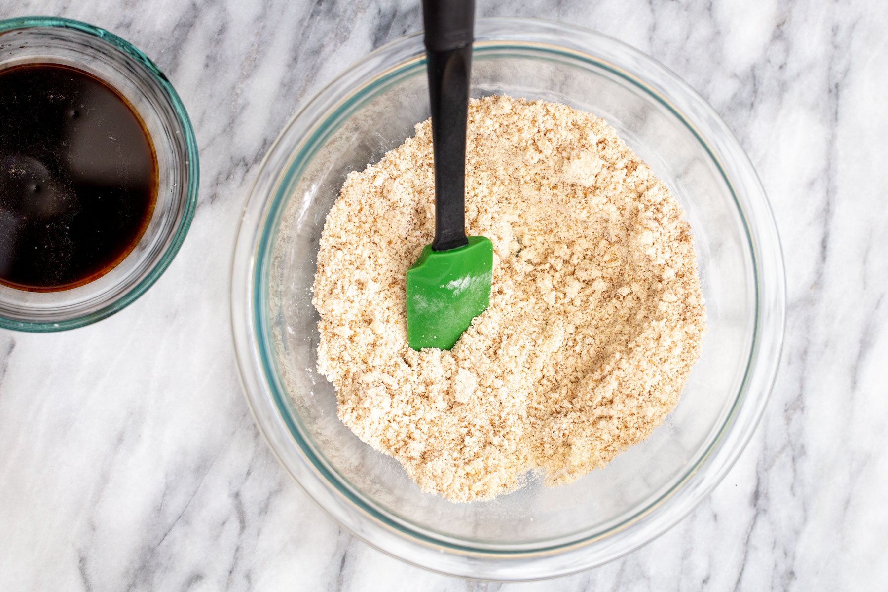 dry ingredients in a glass bowl on a marble countertop