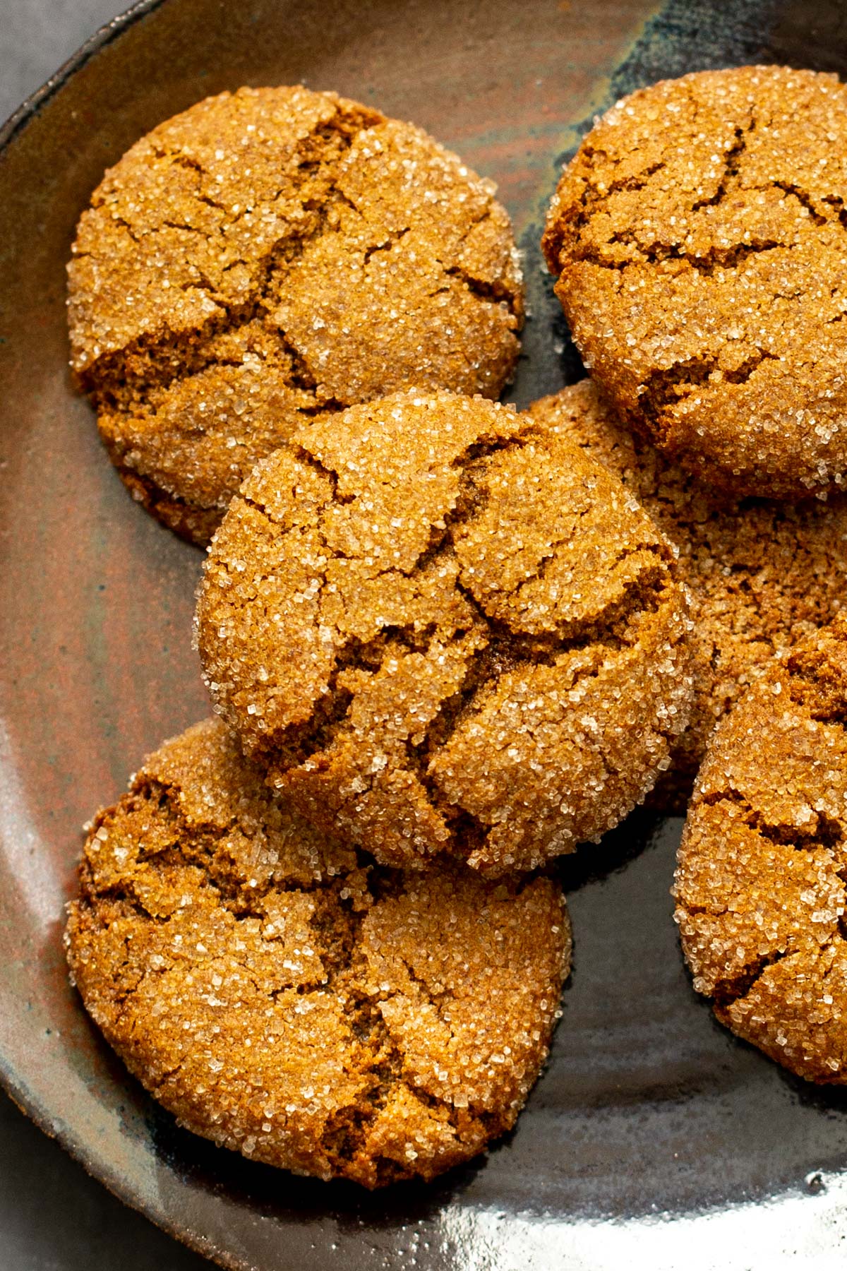 a brown plate with almond flour ginger cookies with crinkly tops
