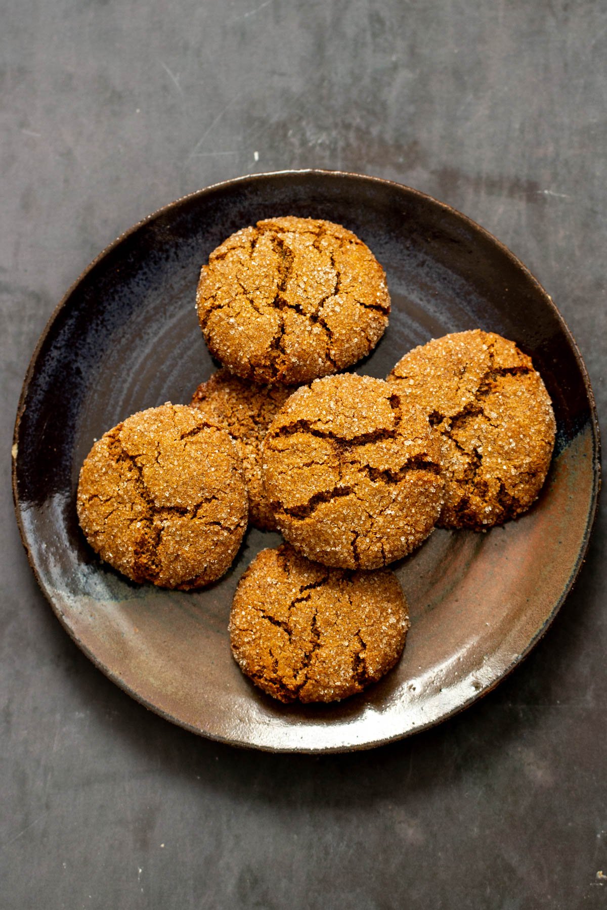 a plate of soft spiced almond flour ginger cookies with crinkly tops