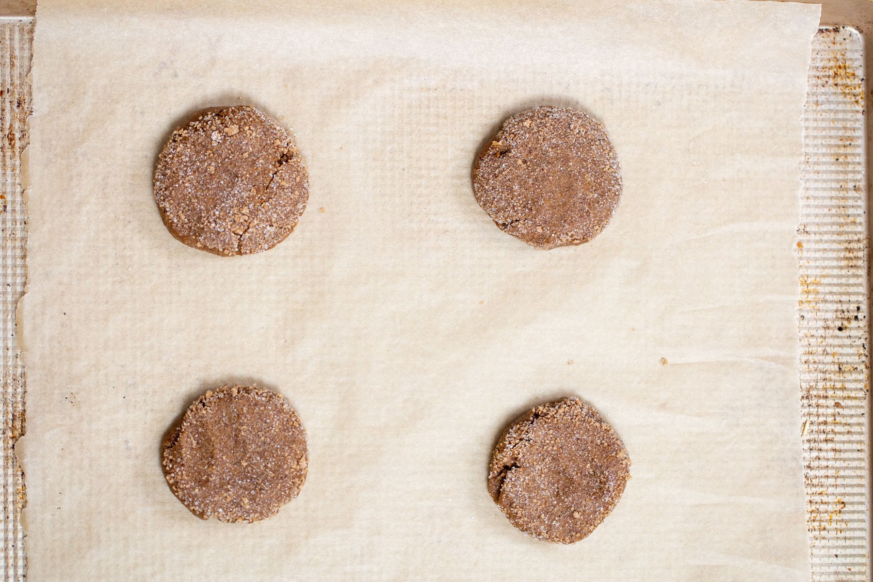 unbaked almond flour cookies on a baking sheet.