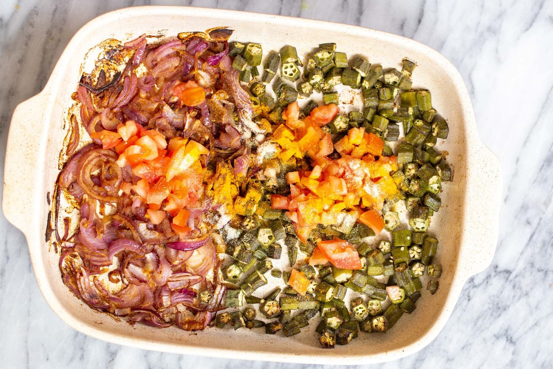 baked veggies in a white casserole dish