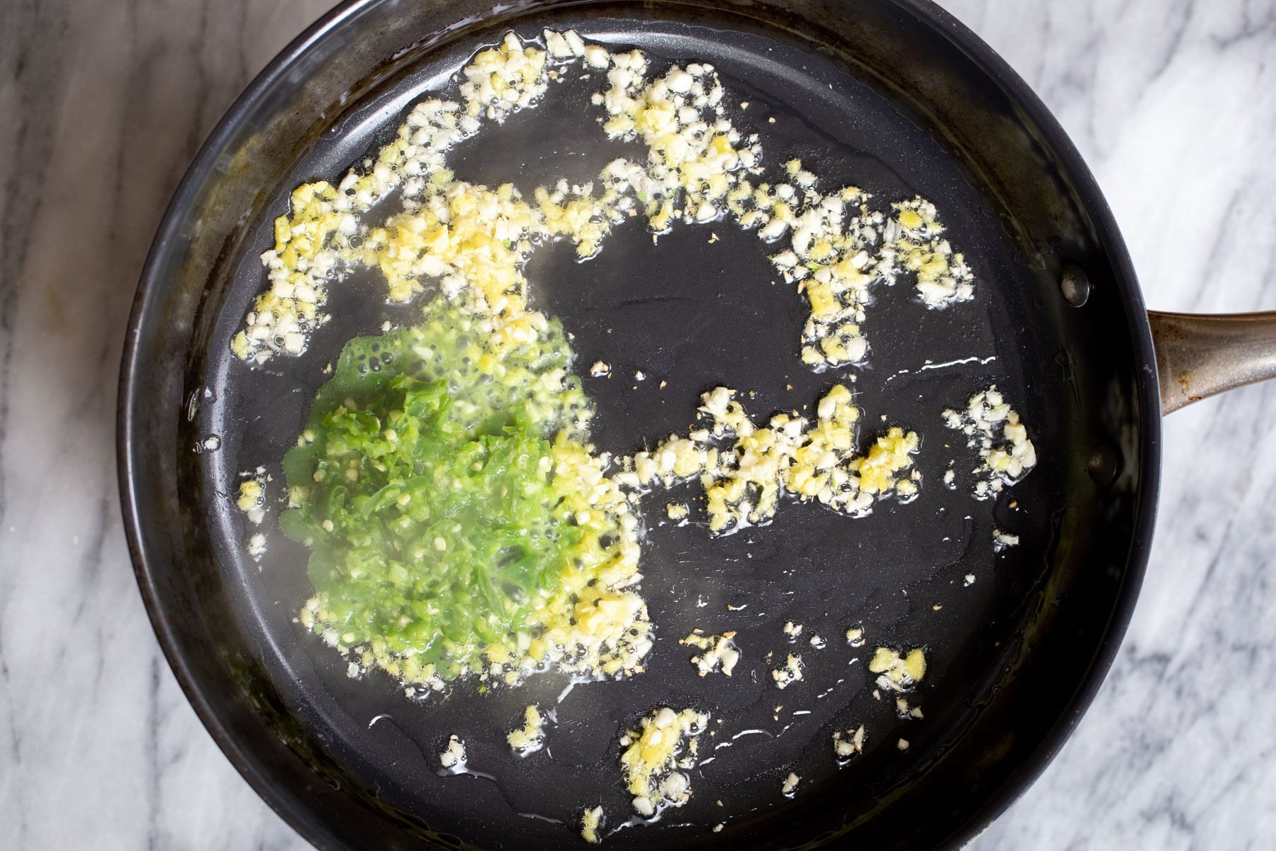 garlic and ginger in a sauteeing pan