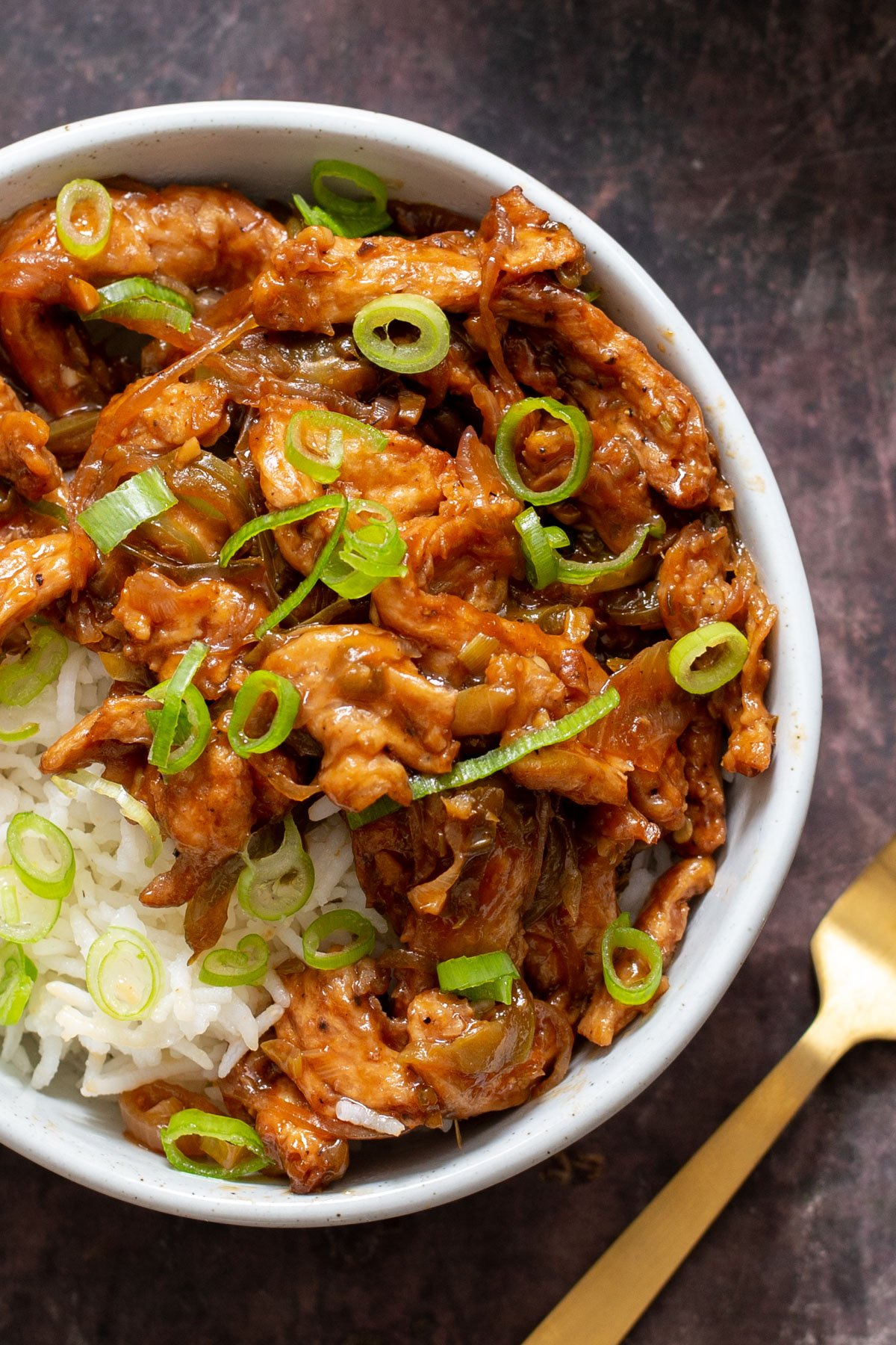 overhead shot of vegan chili chicken sprinkled with chopped green onions