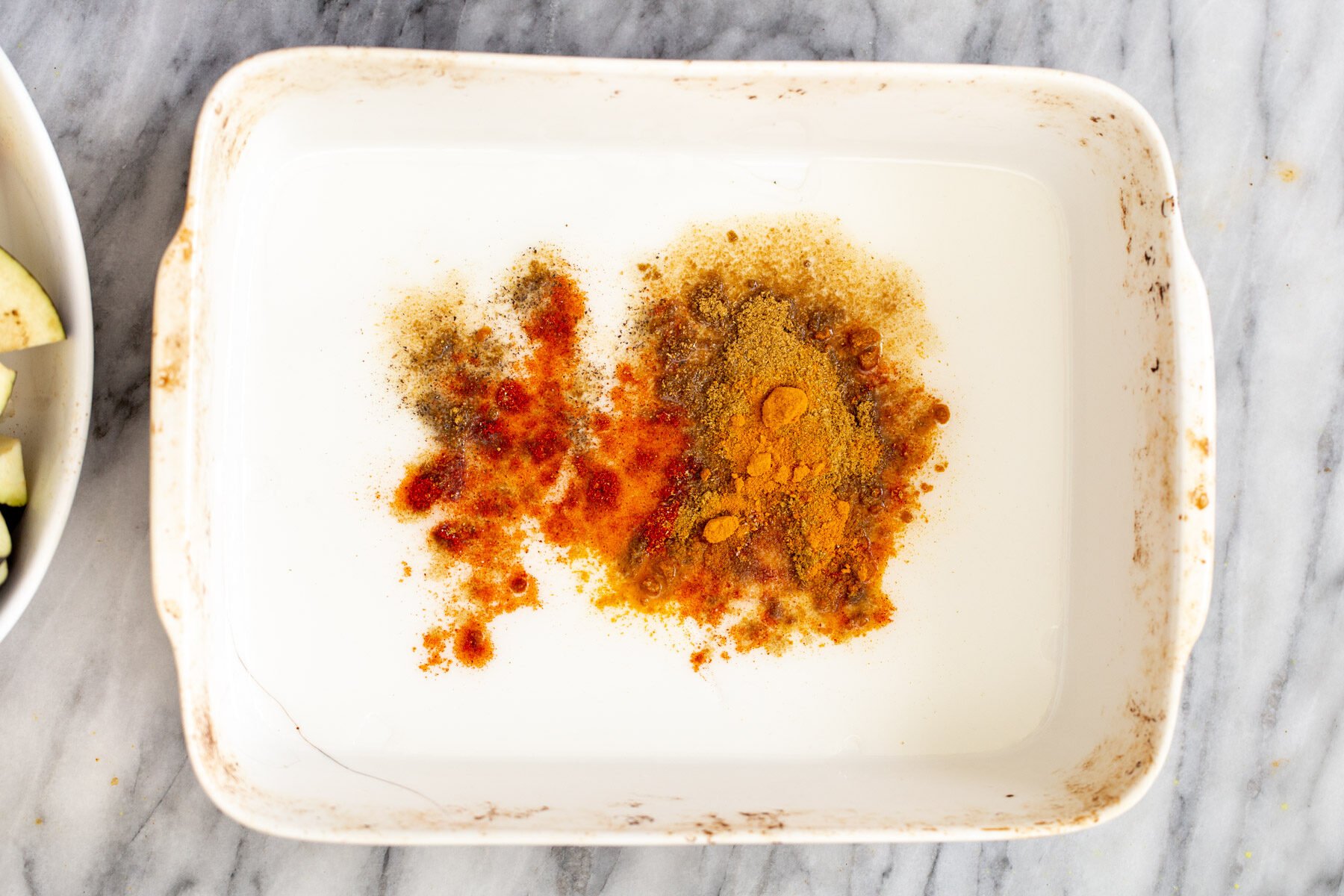 spices in a white casserole dish