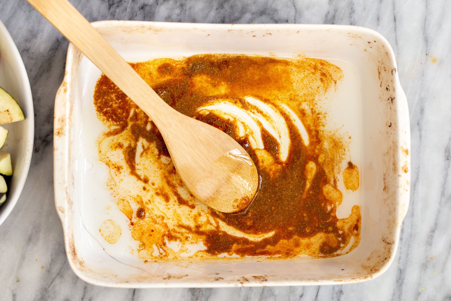 spice paste in a white casserole dish