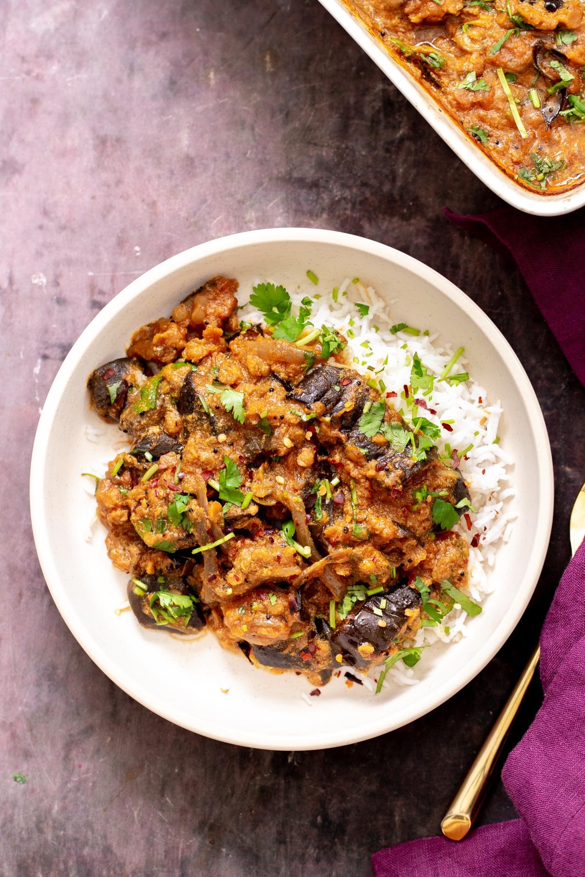 eggplant curry recipe baked eggplant curry served over rice sprinkled with cilantro