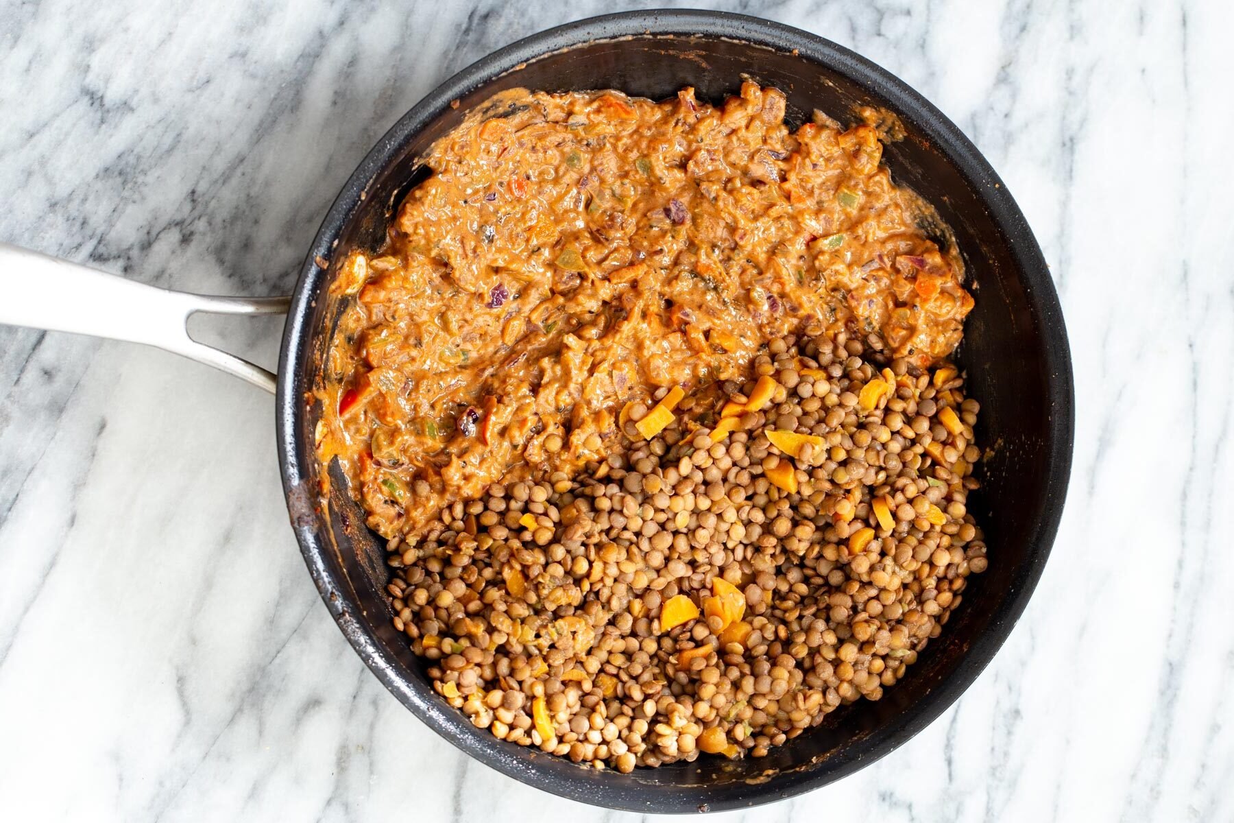 gravy and lentils in a black skillet