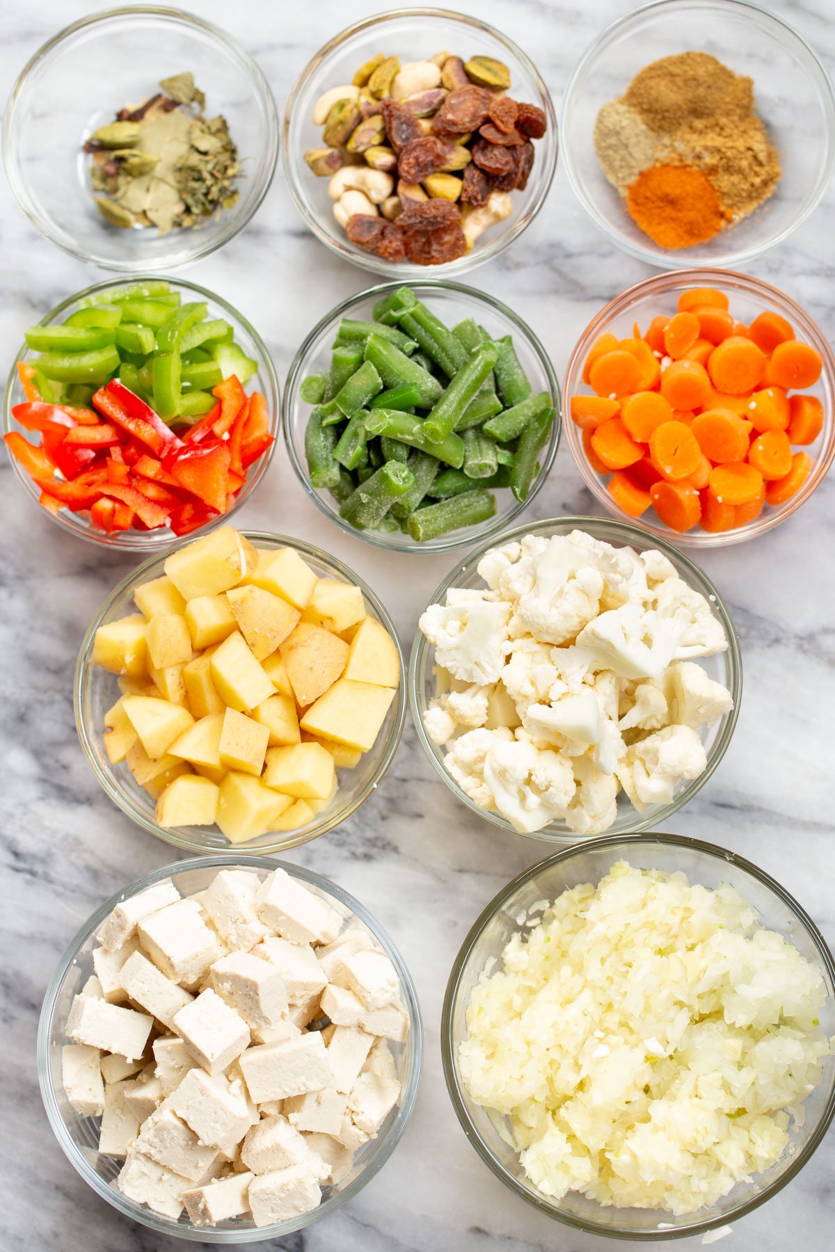 Navratan Korma  ingredients on a marble countertop