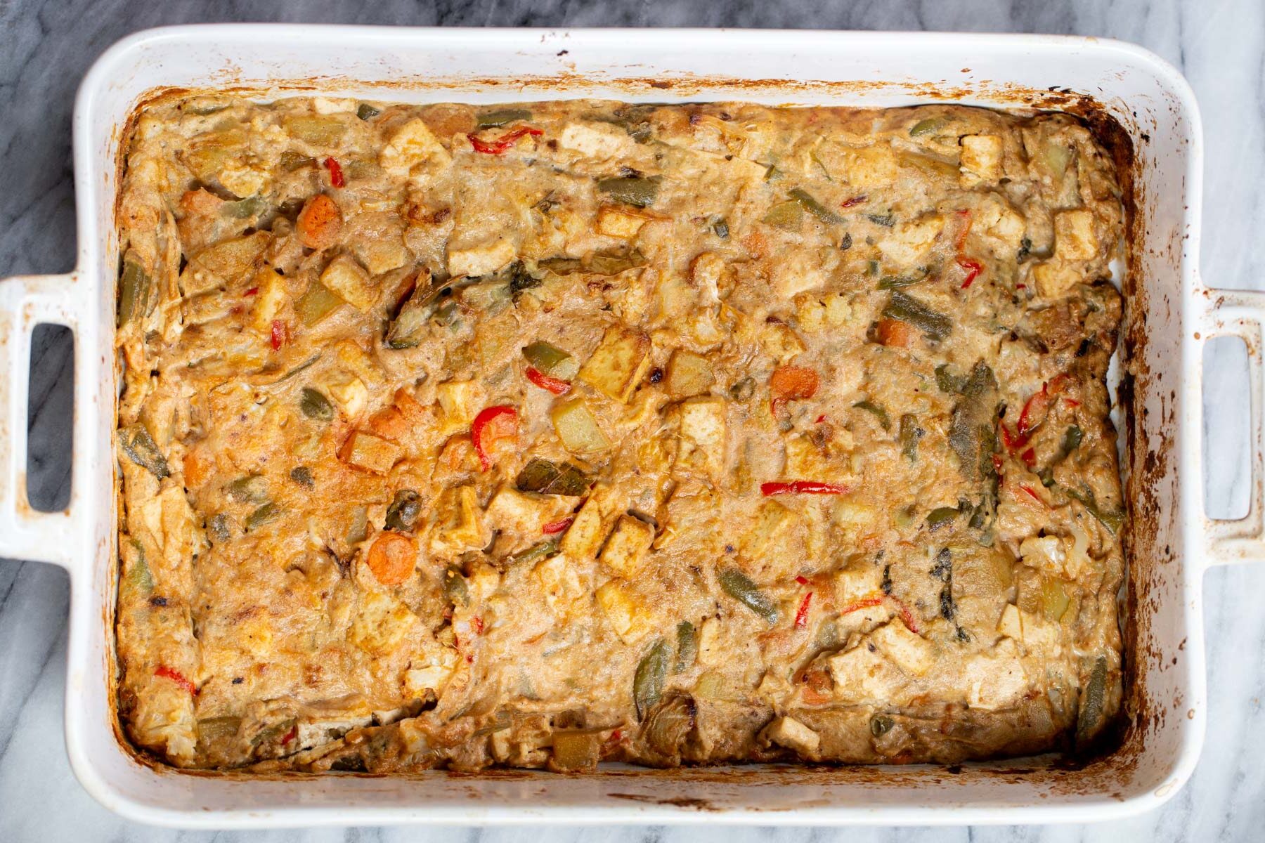 Navratan Korma  Baked Vegan Navratan Korma in a white casserole dish