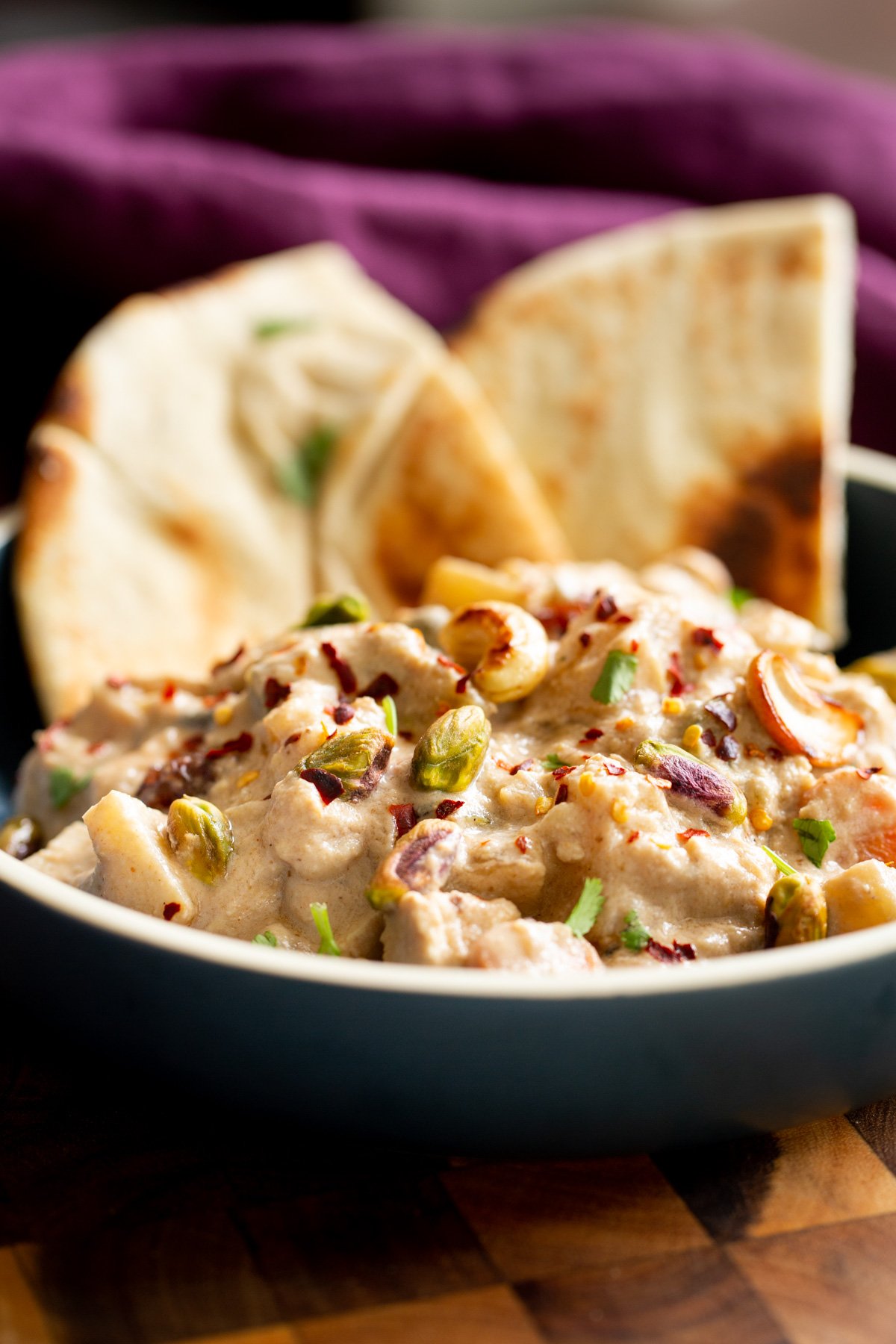 Navratan Korma a bowl of vegan navratan korma served with pita bread