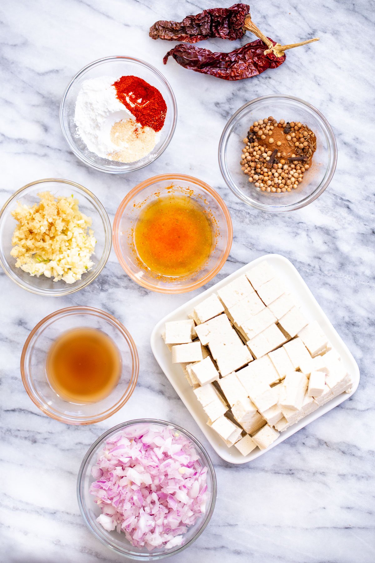 tofu vindaloo ingredients for vindaloo curry on a marble countertop