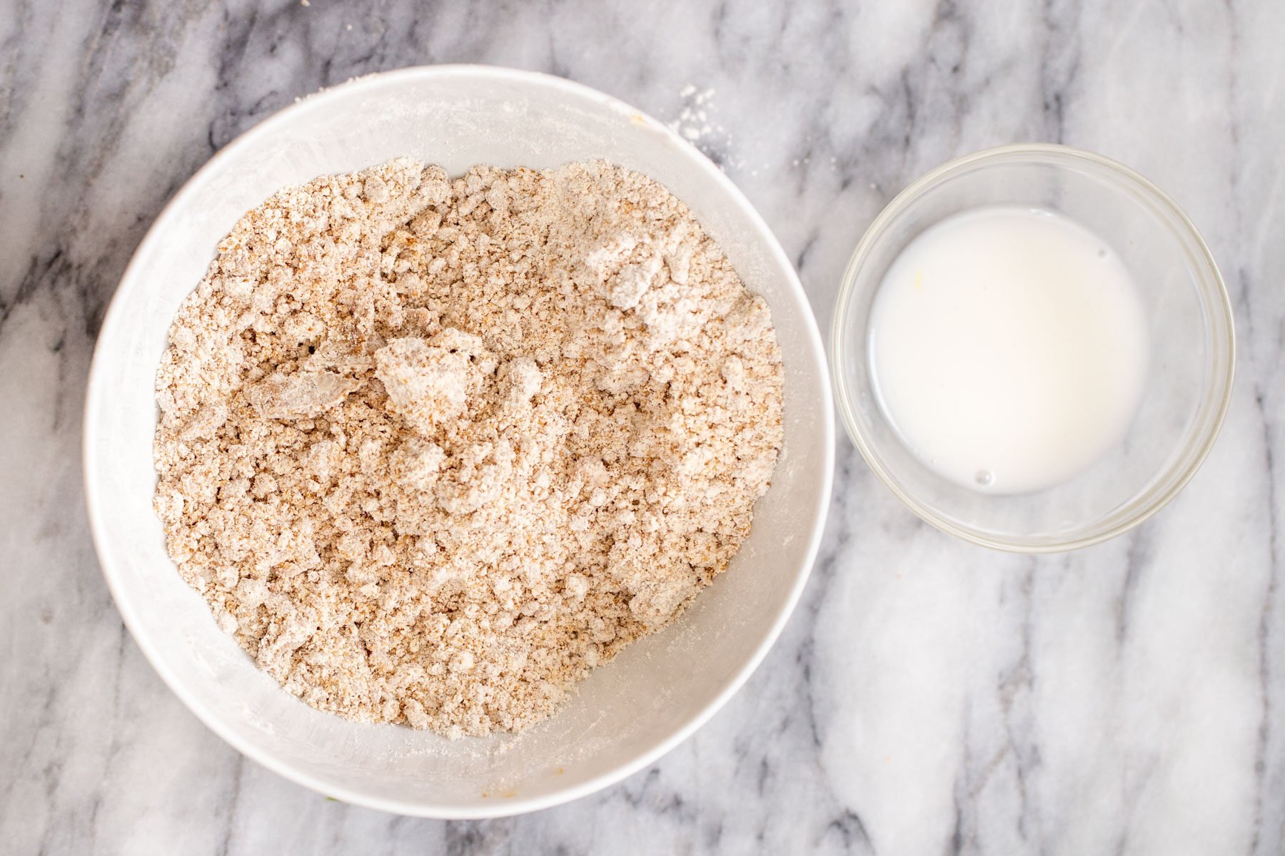 crust ingredients being combined in a white bowl