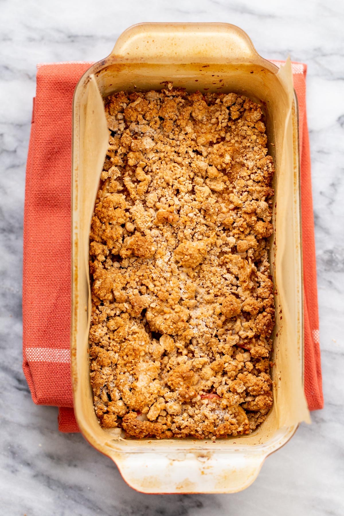 freshly baked vegan apple pie bars on a marble countertop